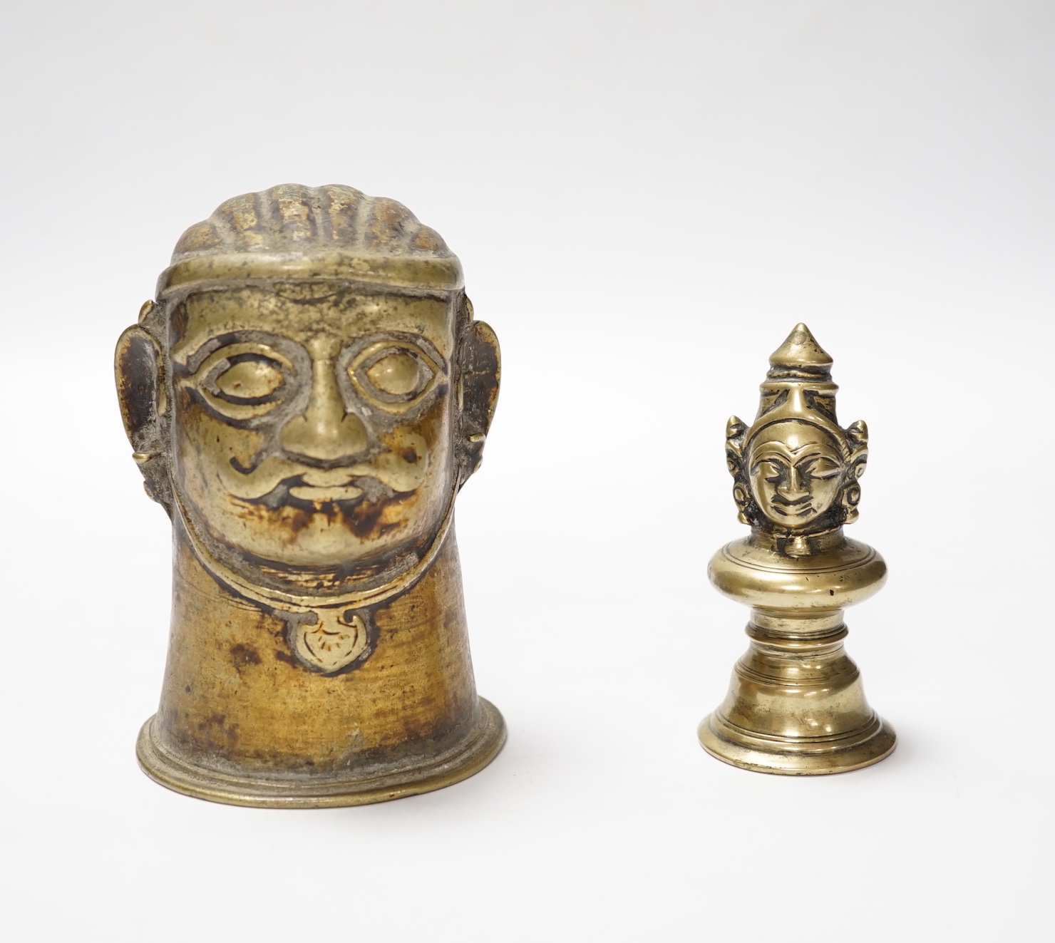 Two brass alloy Shiva Mukhalingam, Southern India, 16th-18th century